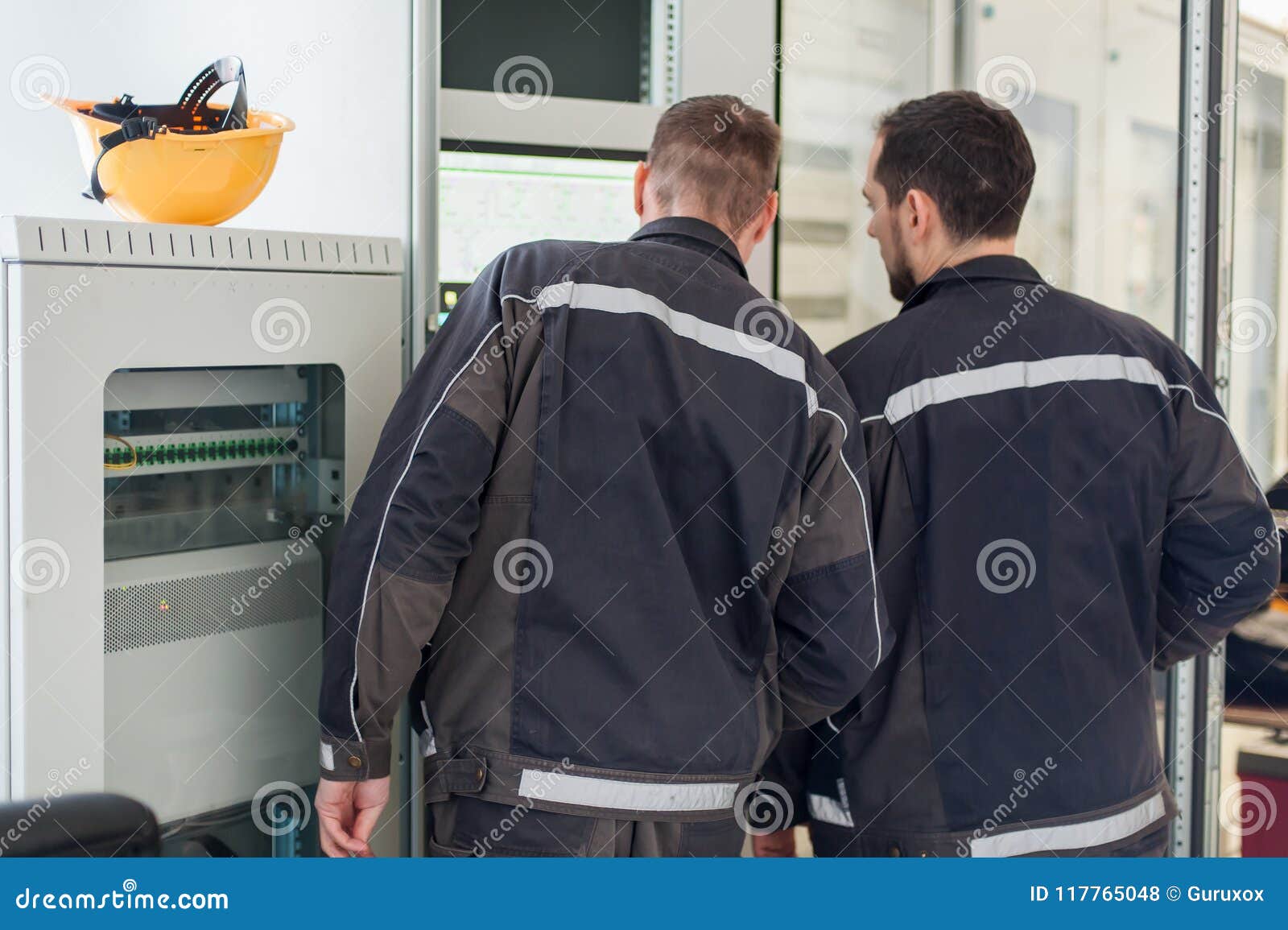 Two Maintenance Engineer Work on Relay Protection System Stock Photo