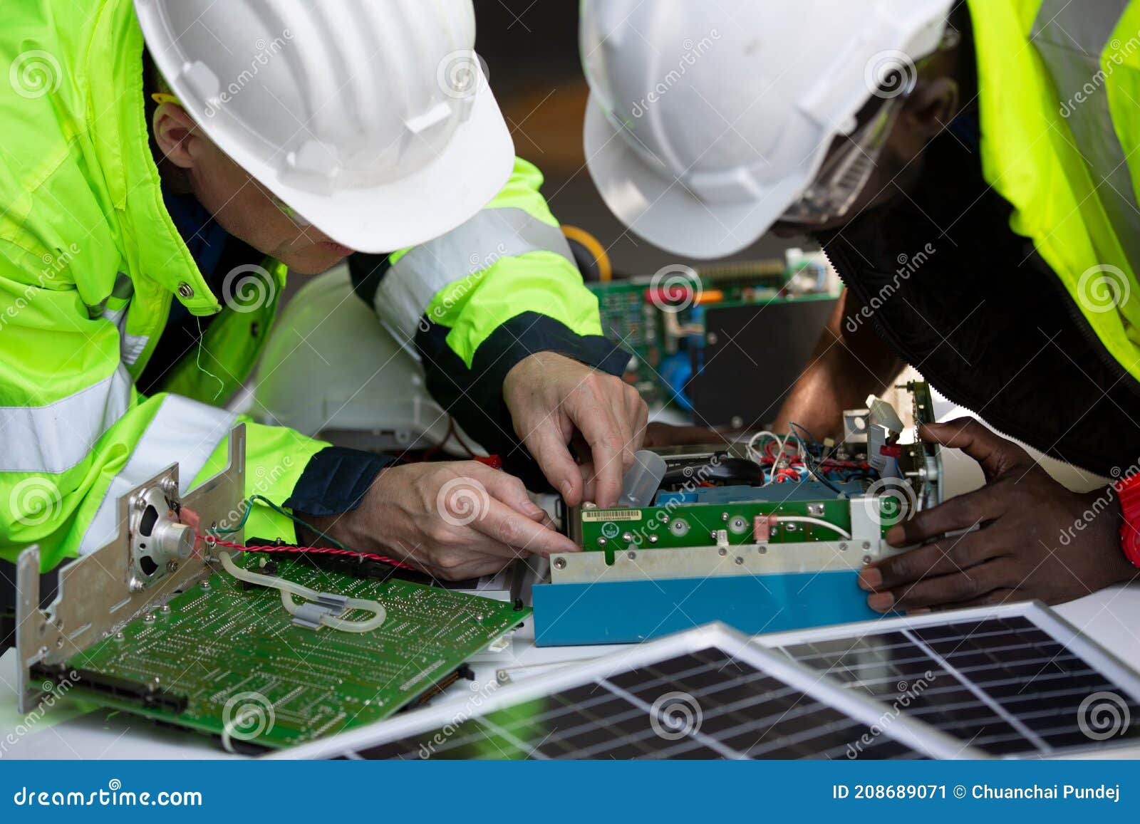 Two Maintenance Engineers Solar Energy Systems Engineer Perform