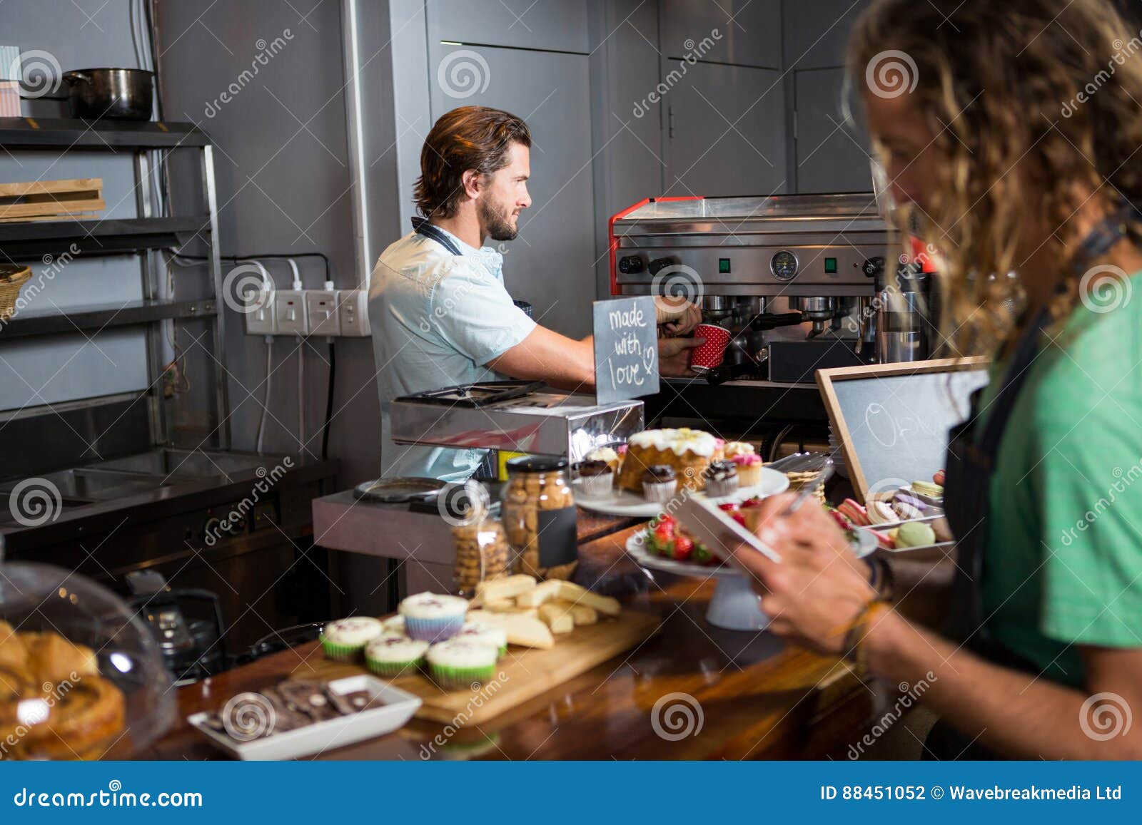 Two Male Staff Working at Counter Stock Photo Image of coworker