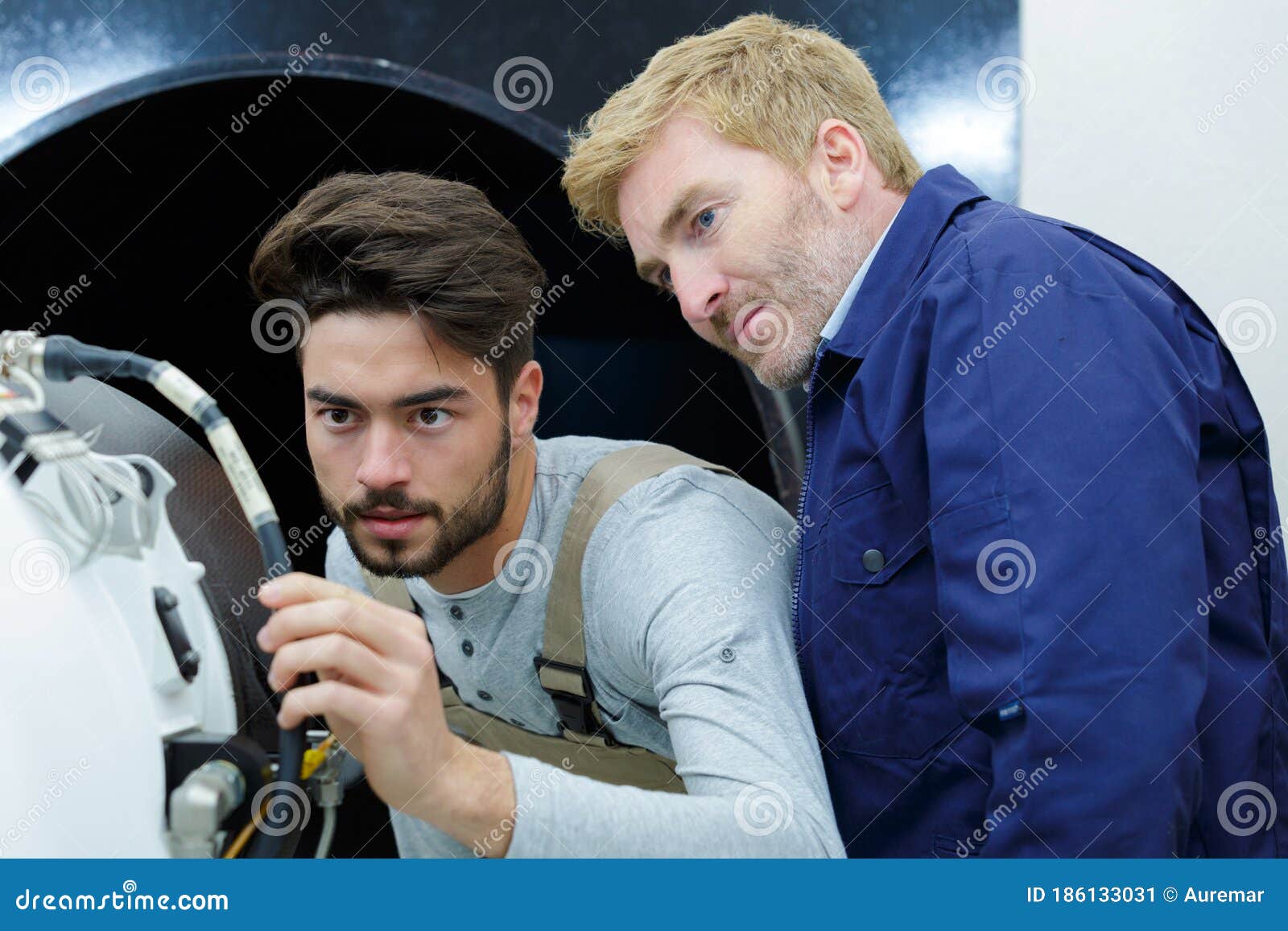 two man worker in piping in factory