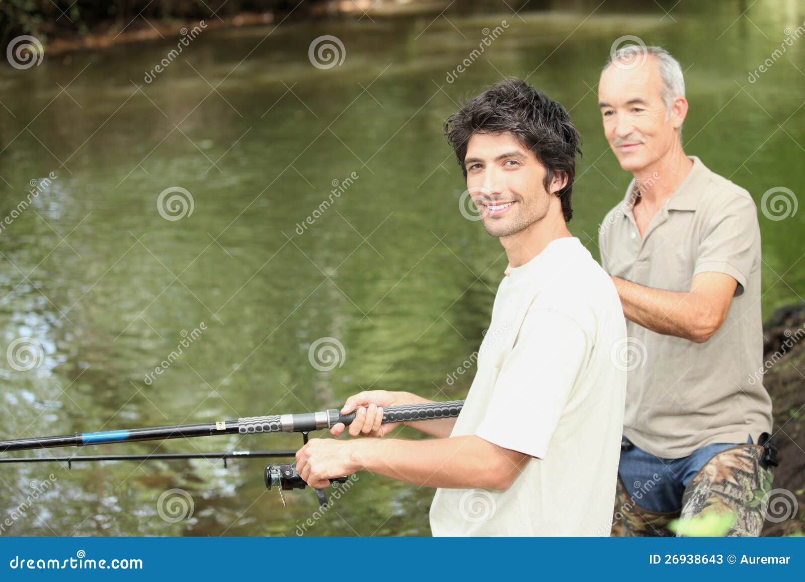 two men angling beside river