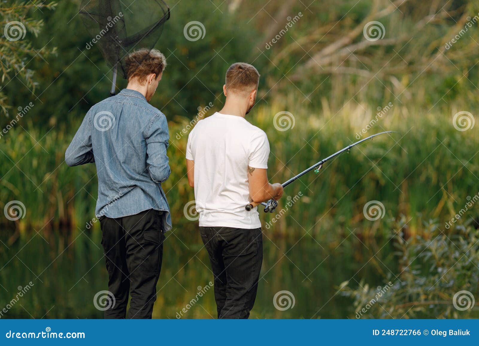 Two Men Fishing Near the River Stock Photo - Image of carry, walking:  248722766