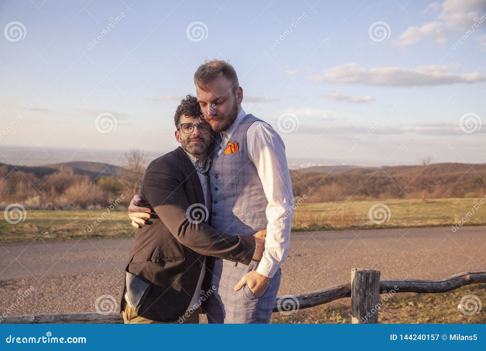 Couple Sitting Hugged On Sea Shore Stock Photo - Image of 
