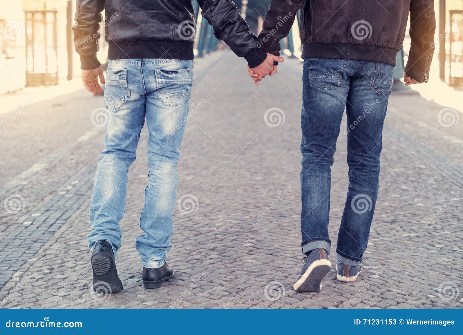 Two men holding hands stock image. Image of friends, partner 71231153