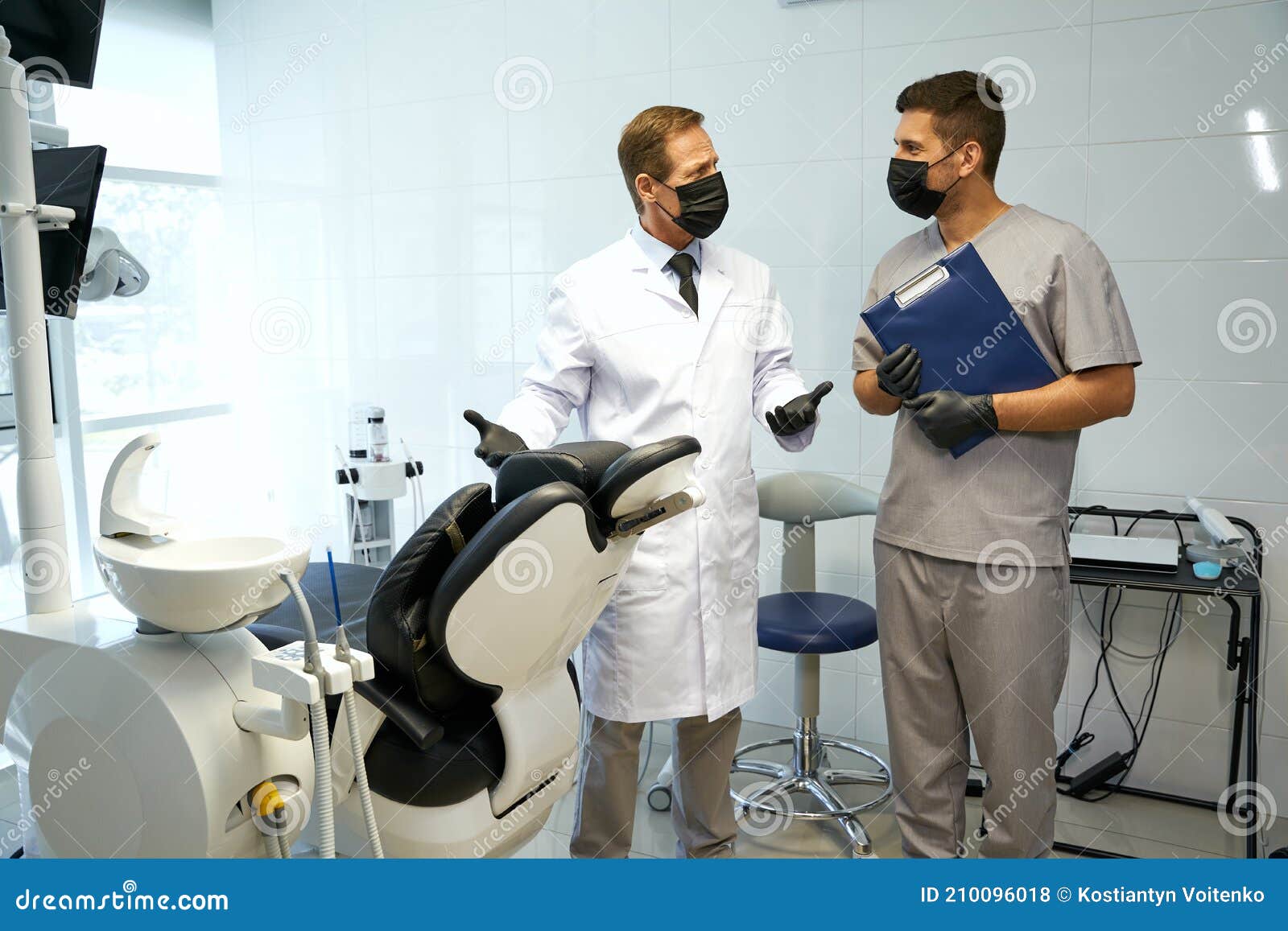 Two Men in Masks and Gloves Working in Dental Clinic Stock Photo Image of health, lifestyle