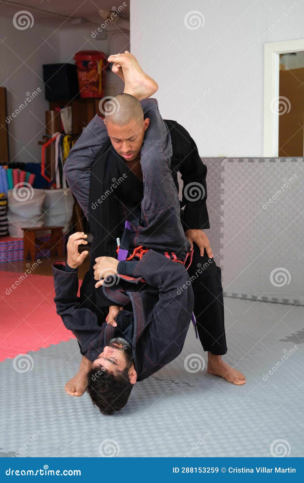 Two Men Practicing Brazilian JiuJitsu Sparring at the Academy. Stock