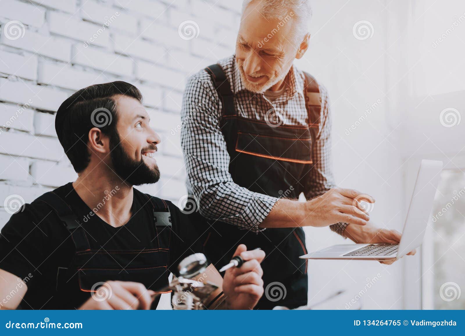 Two Men Repairing Hardware Equipment in Stock Image Image of
