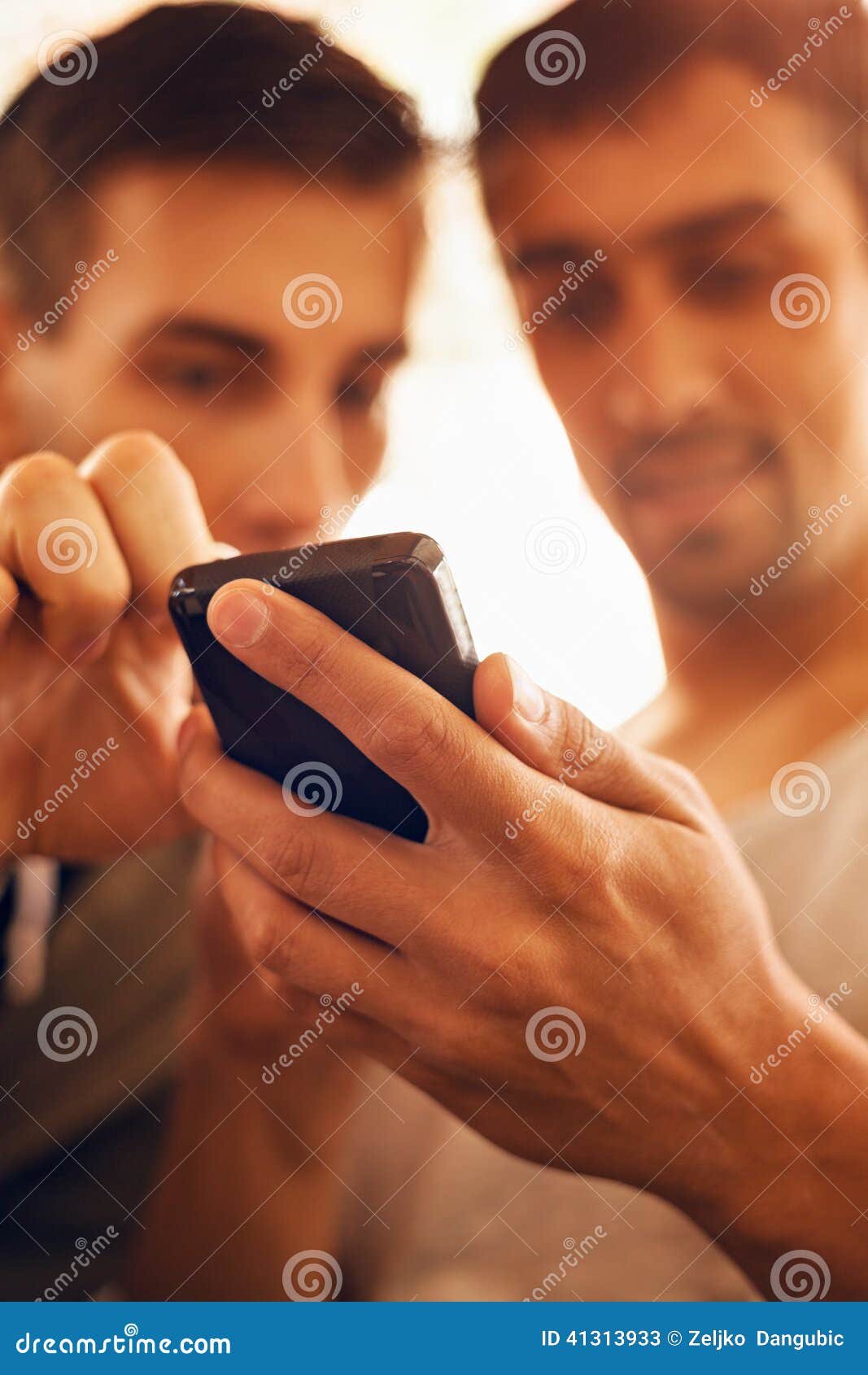 two men using smart phone