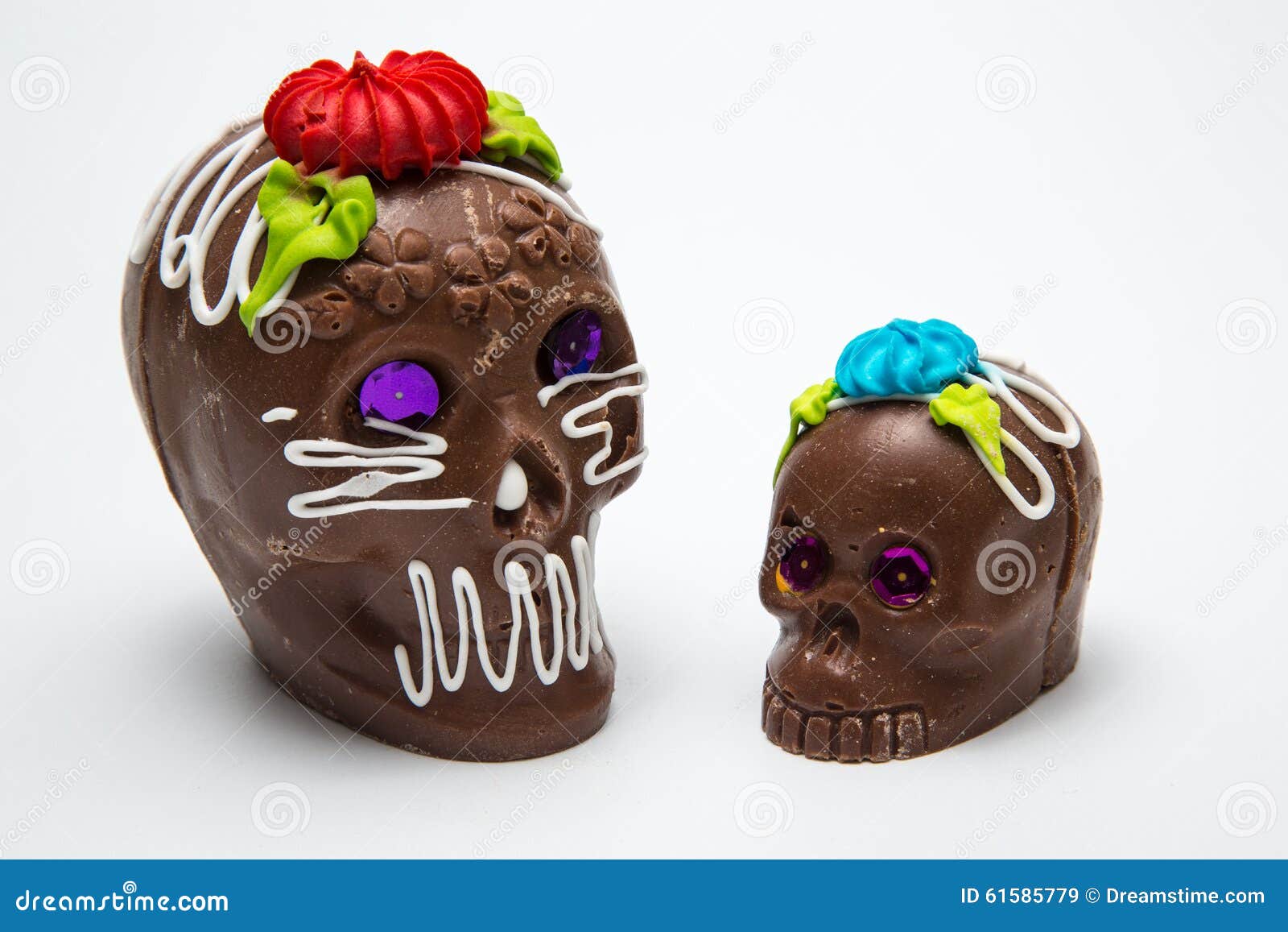 two mexican calaverita de azucar candy skull and calaverita de chocolate,