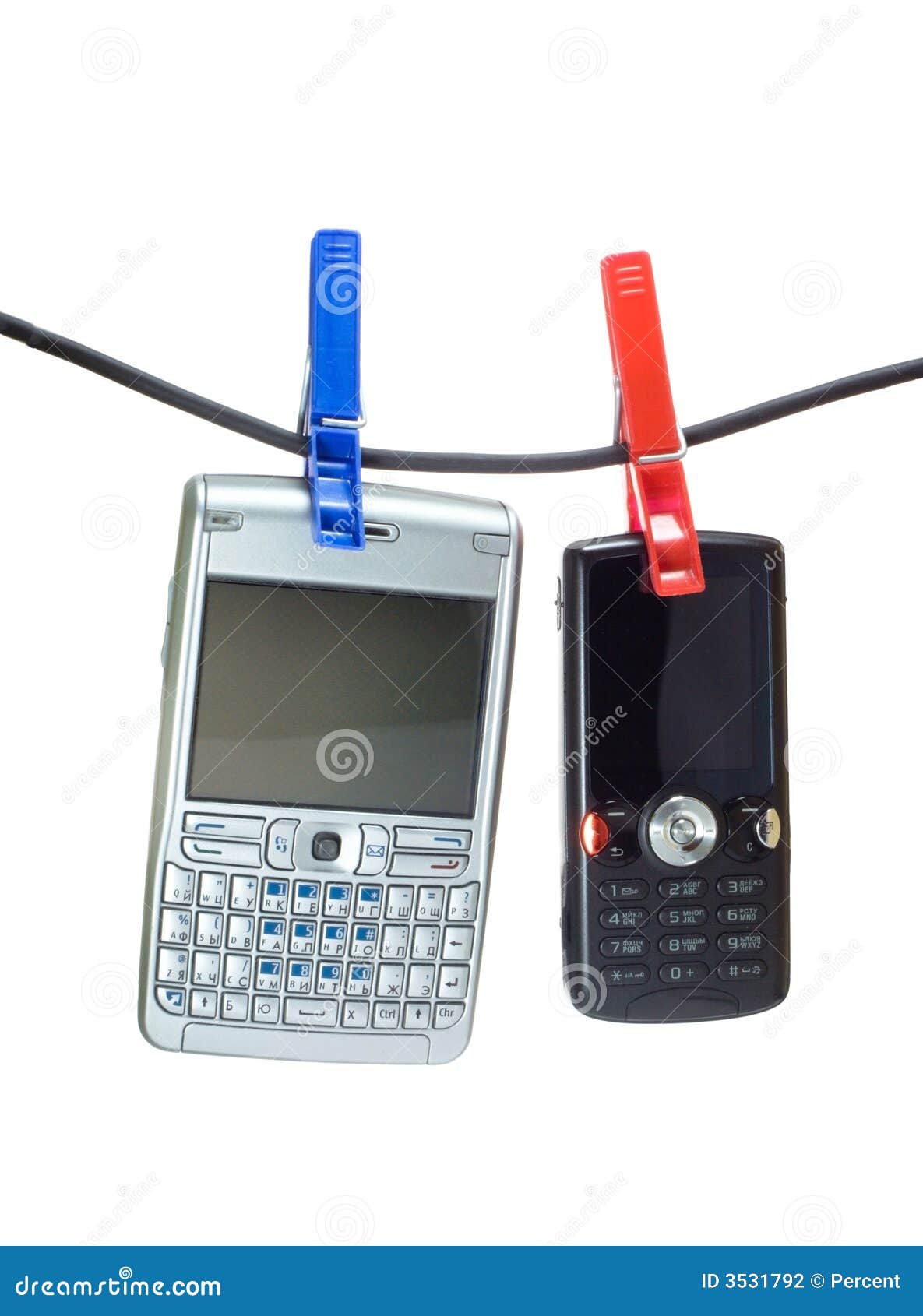 Two Mobiles on a Clothes Line Stock Photo - Image of holding, clip: 3531792