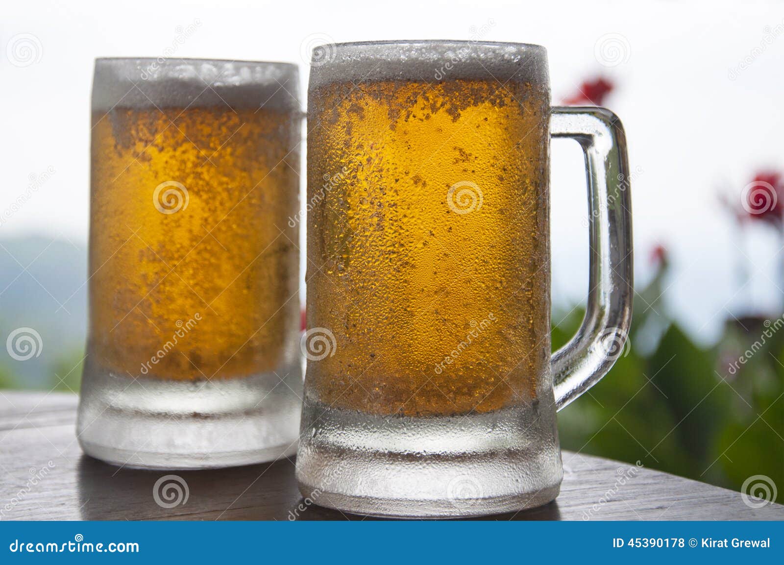 Two Mugs of Chilled Beer stock photo. Image of flavor 45390178