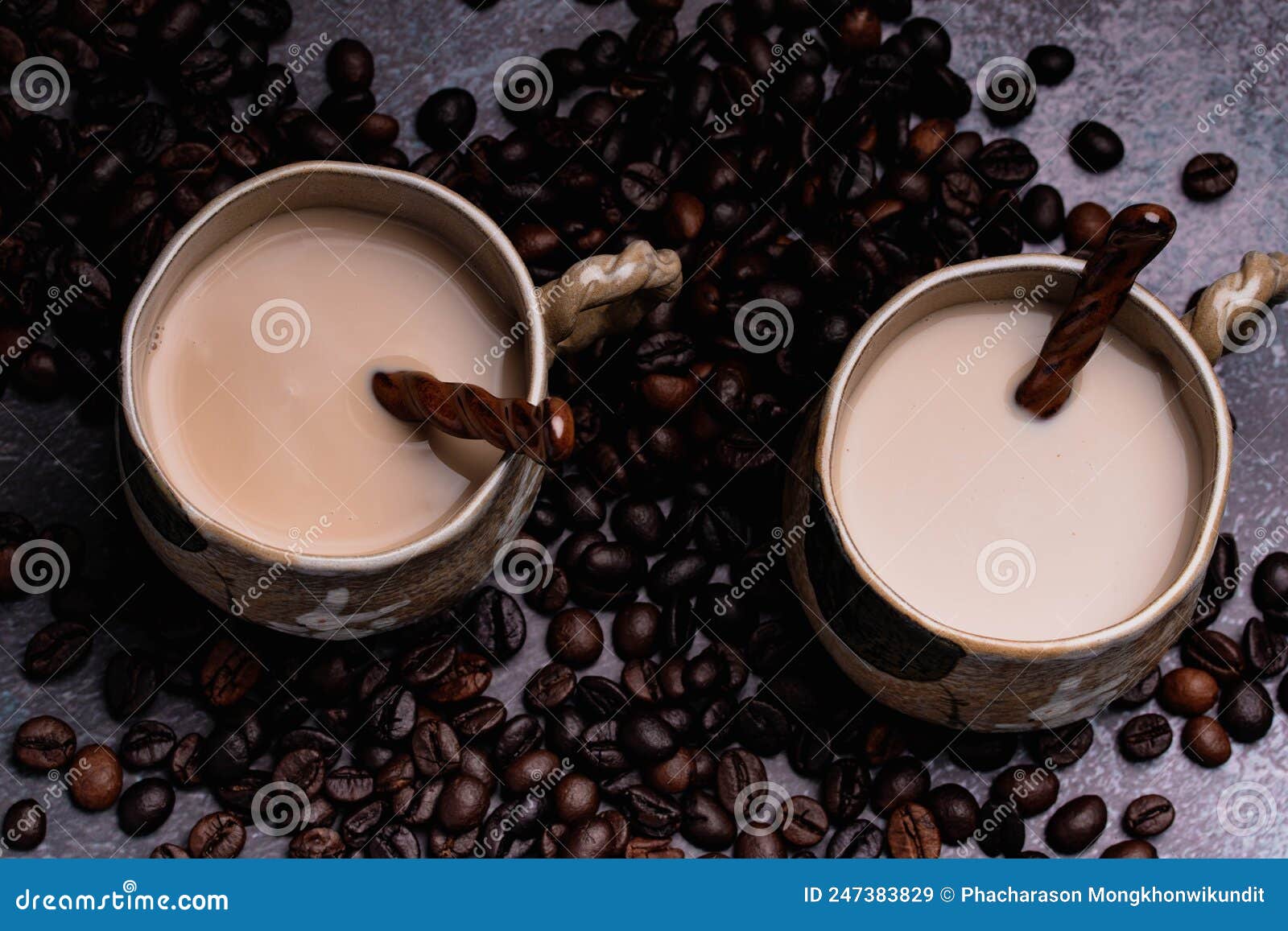 Two Mugs of Coffee with Coffee Beans on a Dark Backdrop Stock Image