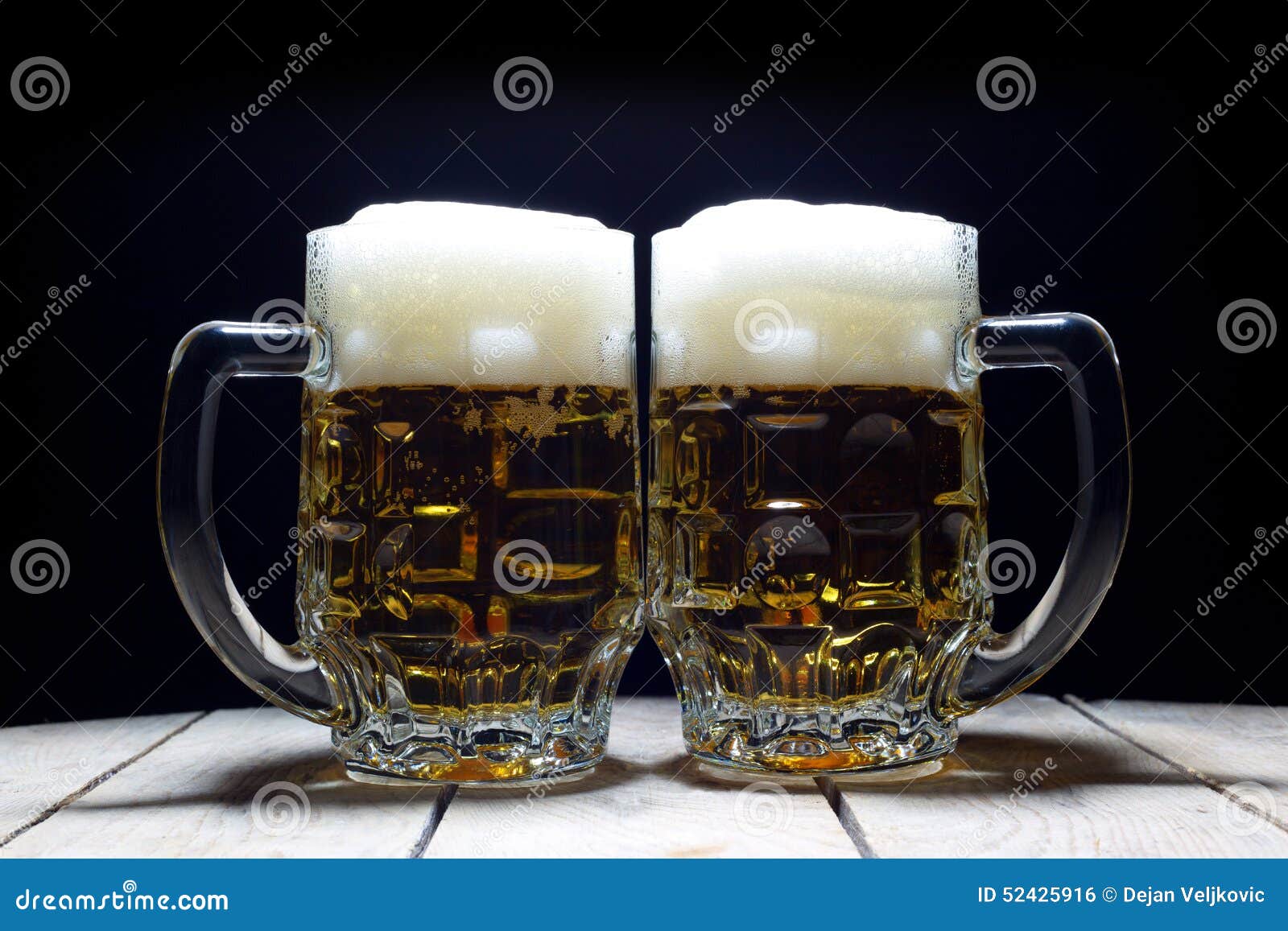 Two Mugs of Cold Beer are the Best Way To Quench Thirst Stock Photo