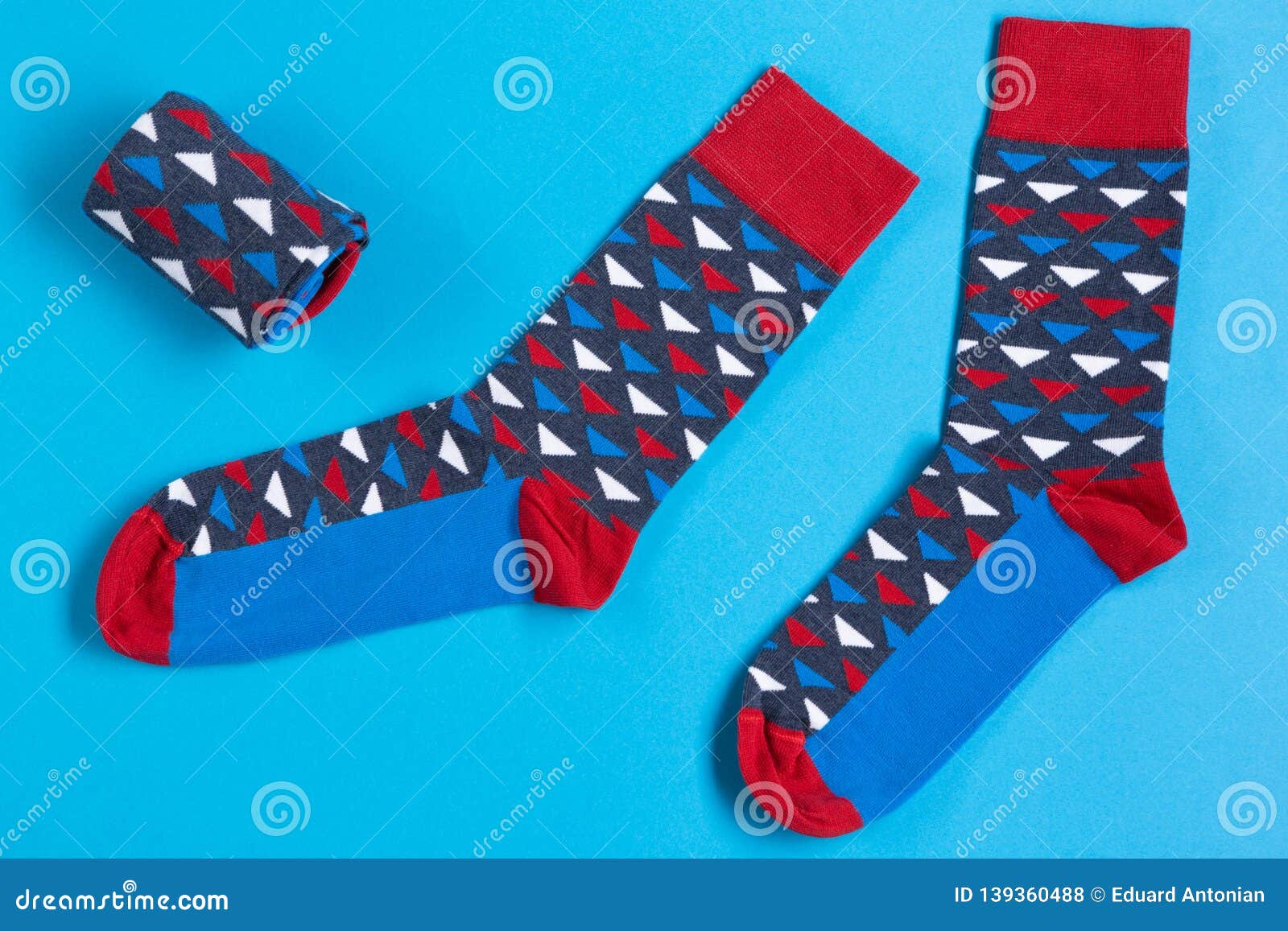 Two Multi-colored Socks are Located on a Blue Background, a Folded Sock ...