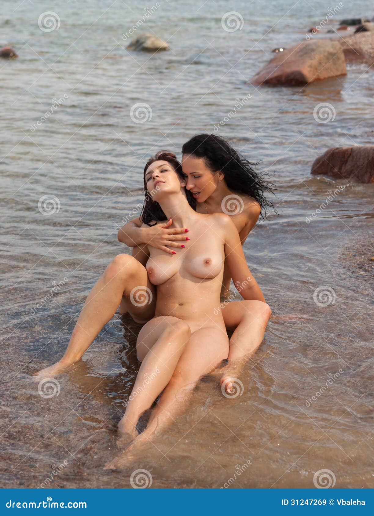 Naked women in water