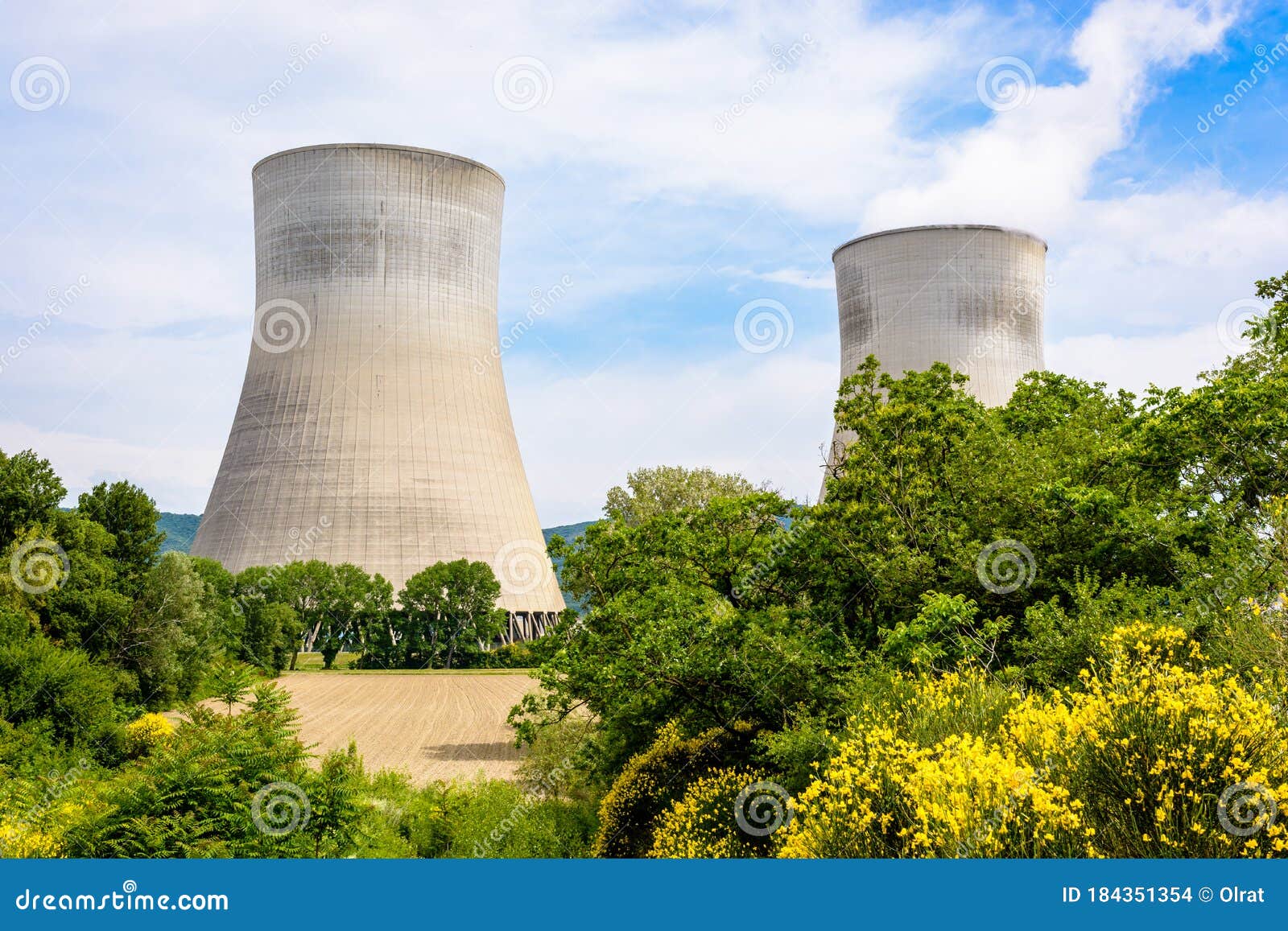 Two Cooling Towers of a Nuclear Power Plant Releasing Vapor Next To a