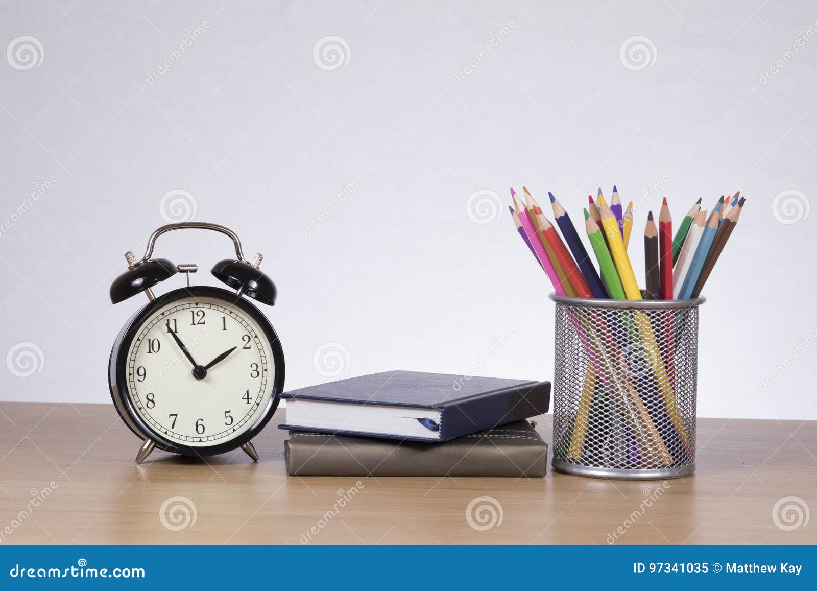 Two Notebooks between Clock and Colored Pencils Stock Image Image of