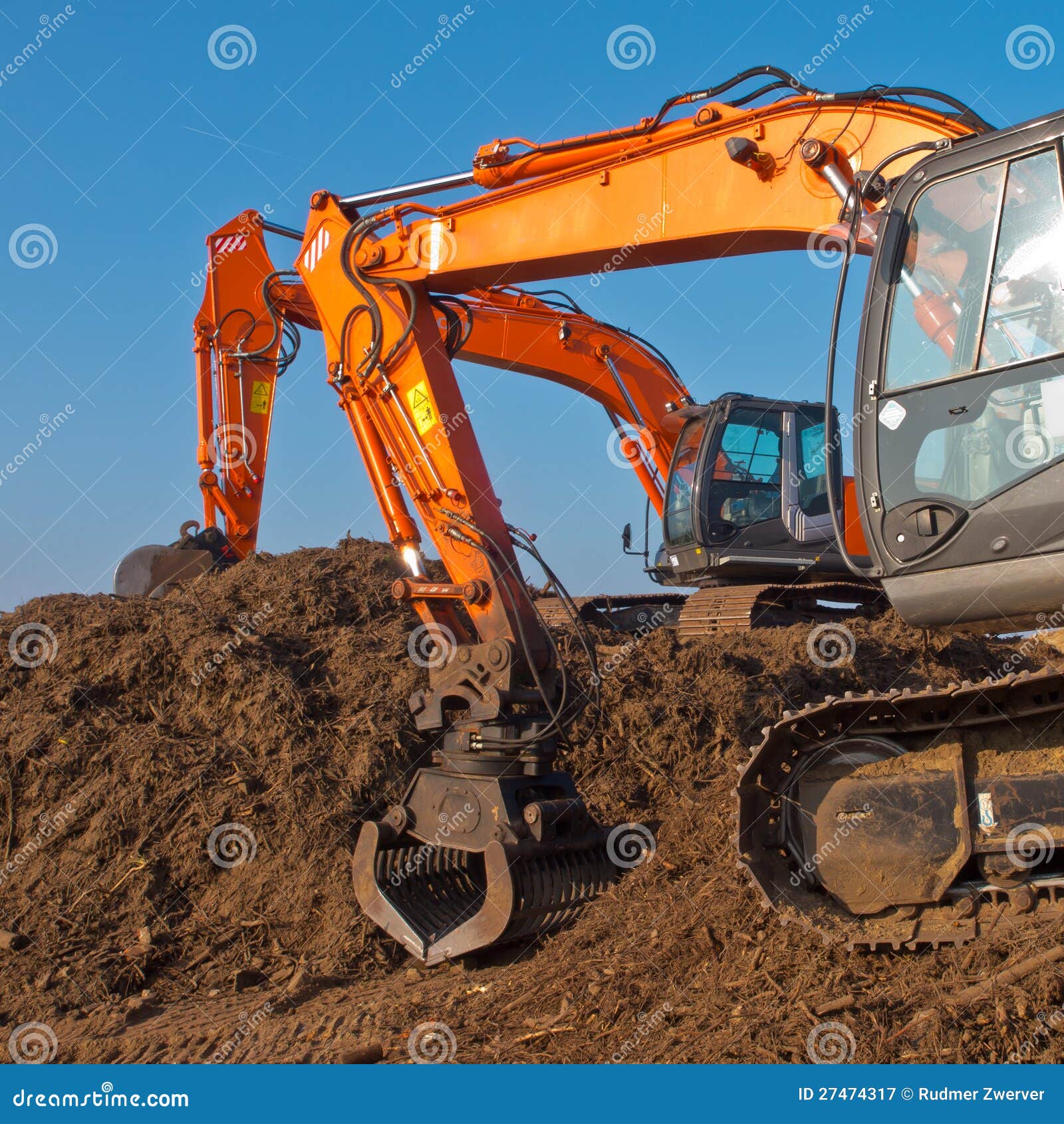 Two orange excavators stock image. Image of hydraulic 27474317