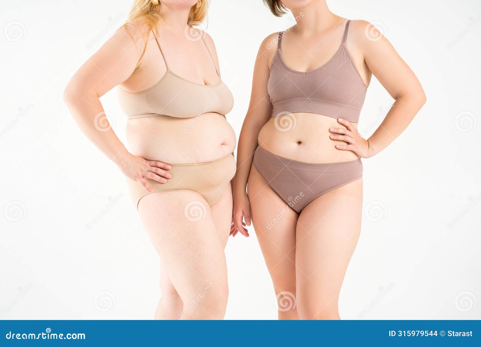 two overweight women with cellulitis, fat flabby bellies, legs, hands, hips and buttocks on gray background, obese female body,