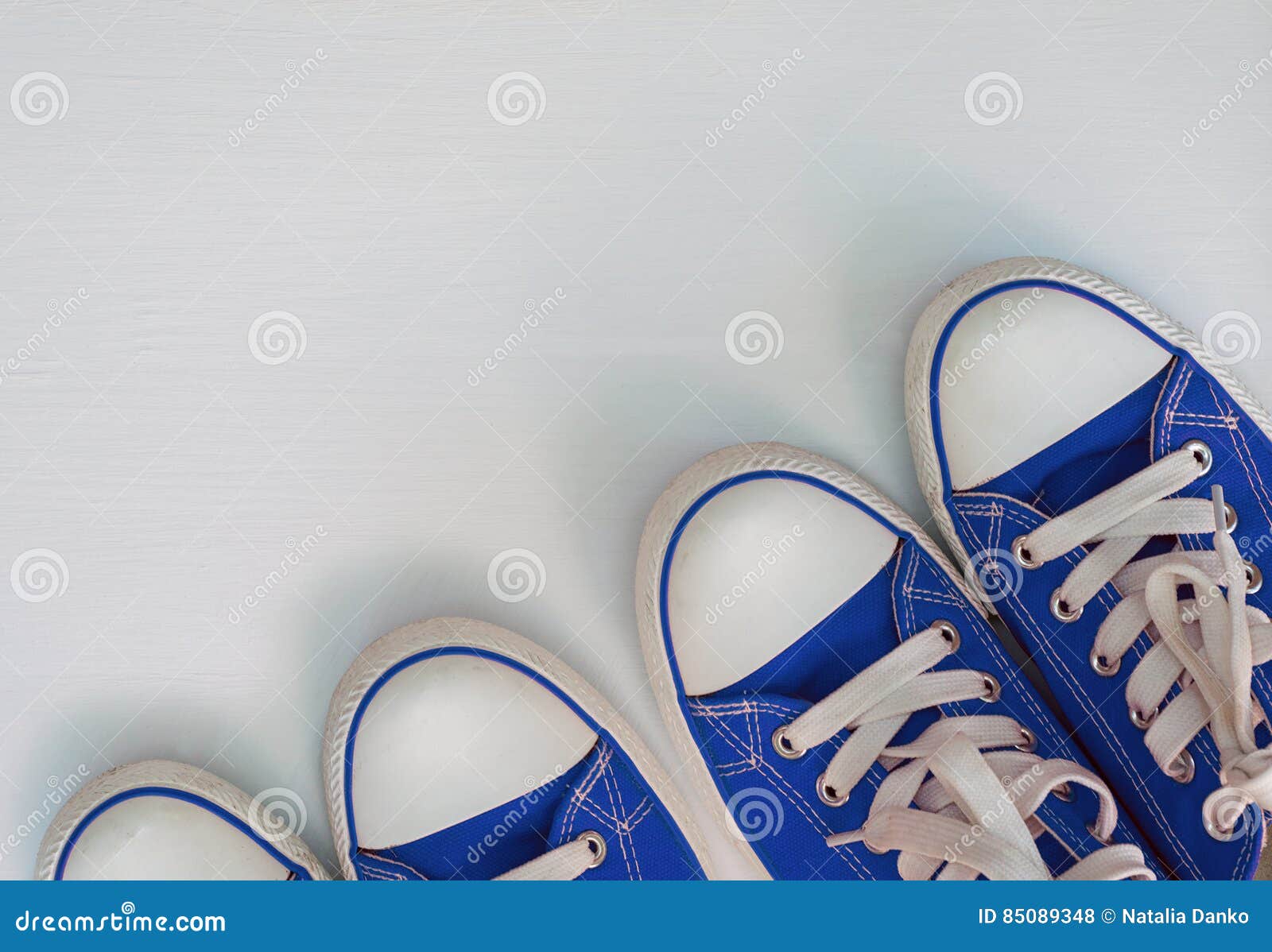 Two Pair Blue Neakers Youth on a White Wooden Surface Stock Photo ...