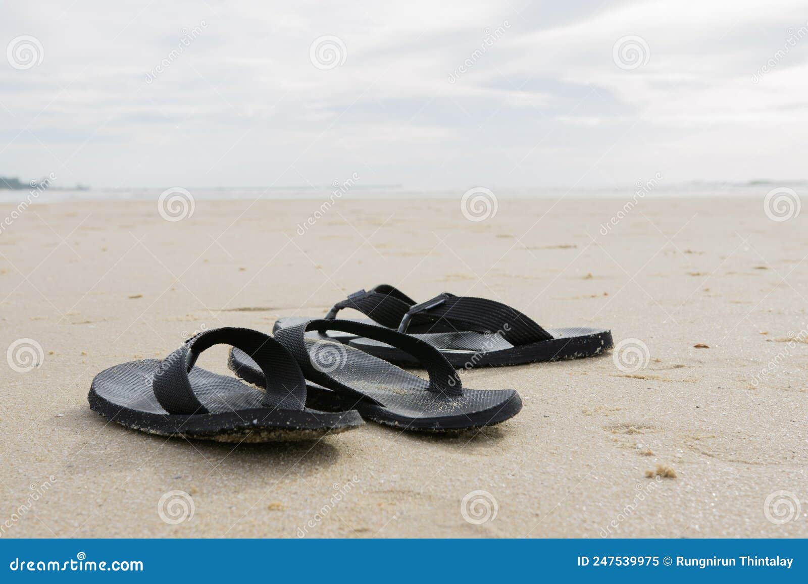 Two Pairs of Black Flip Flops Lay on Cha am Beach, Phetchaburi ...