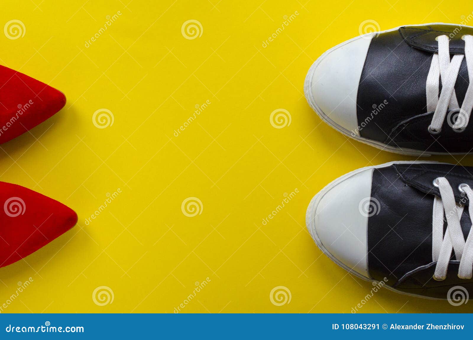 Two Pairs of Shoes Opposite on Yellow Background Stock Image - Image of ...