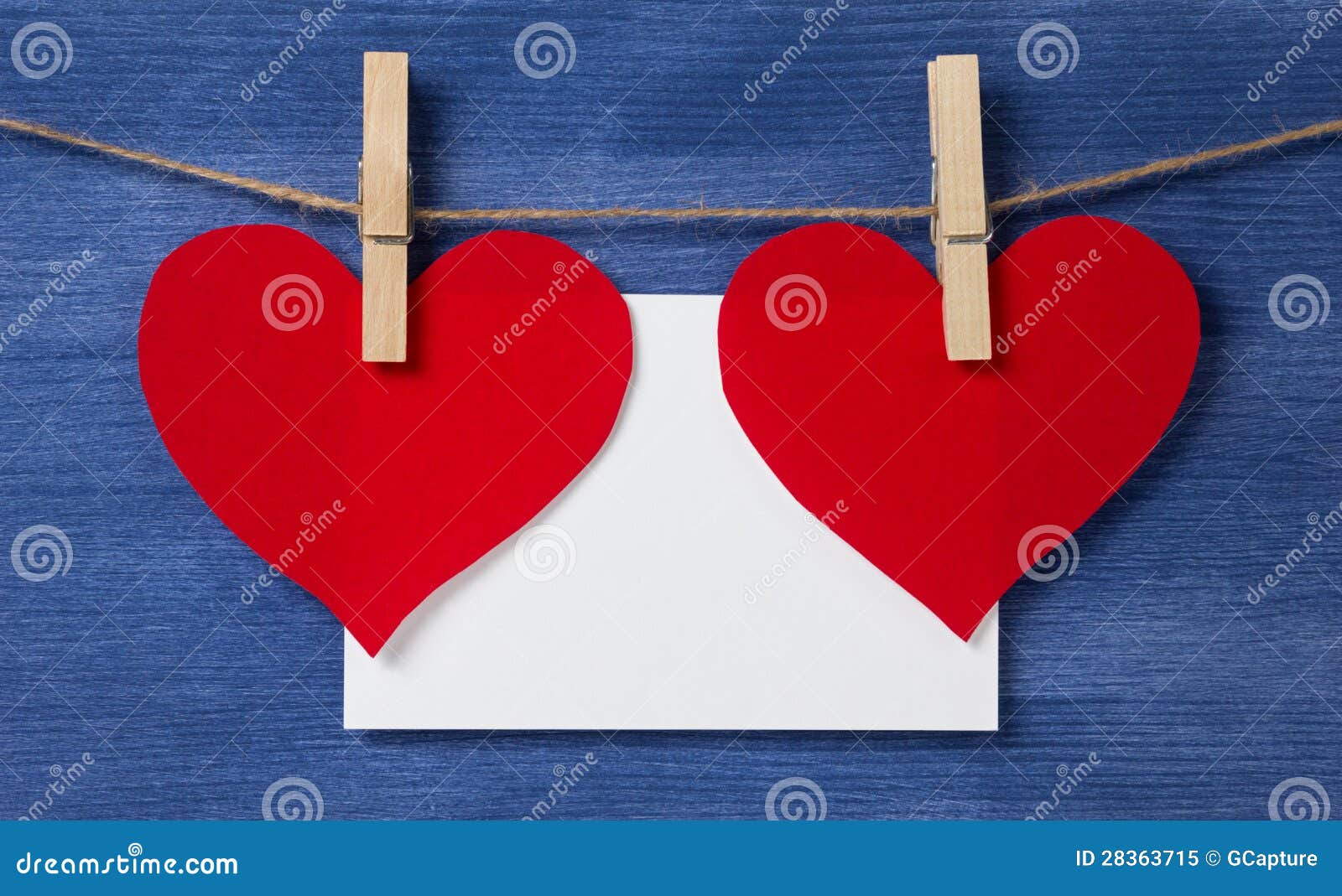 Paper And Card Hanging On A Rope Two Paper Hearts And Card Hanging On A Rope Stock Image