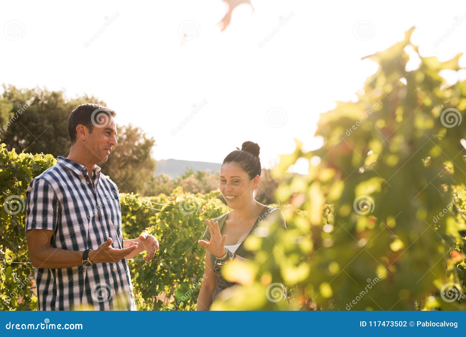 two people having a chat in the vineyards