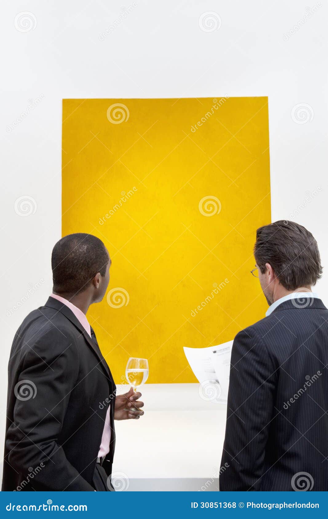 Young Caucasian People In An Art Gallery Looking At Paintings And Talking  About Them Stock Photo, Picture and Royalty Free Image. Image 22573792.