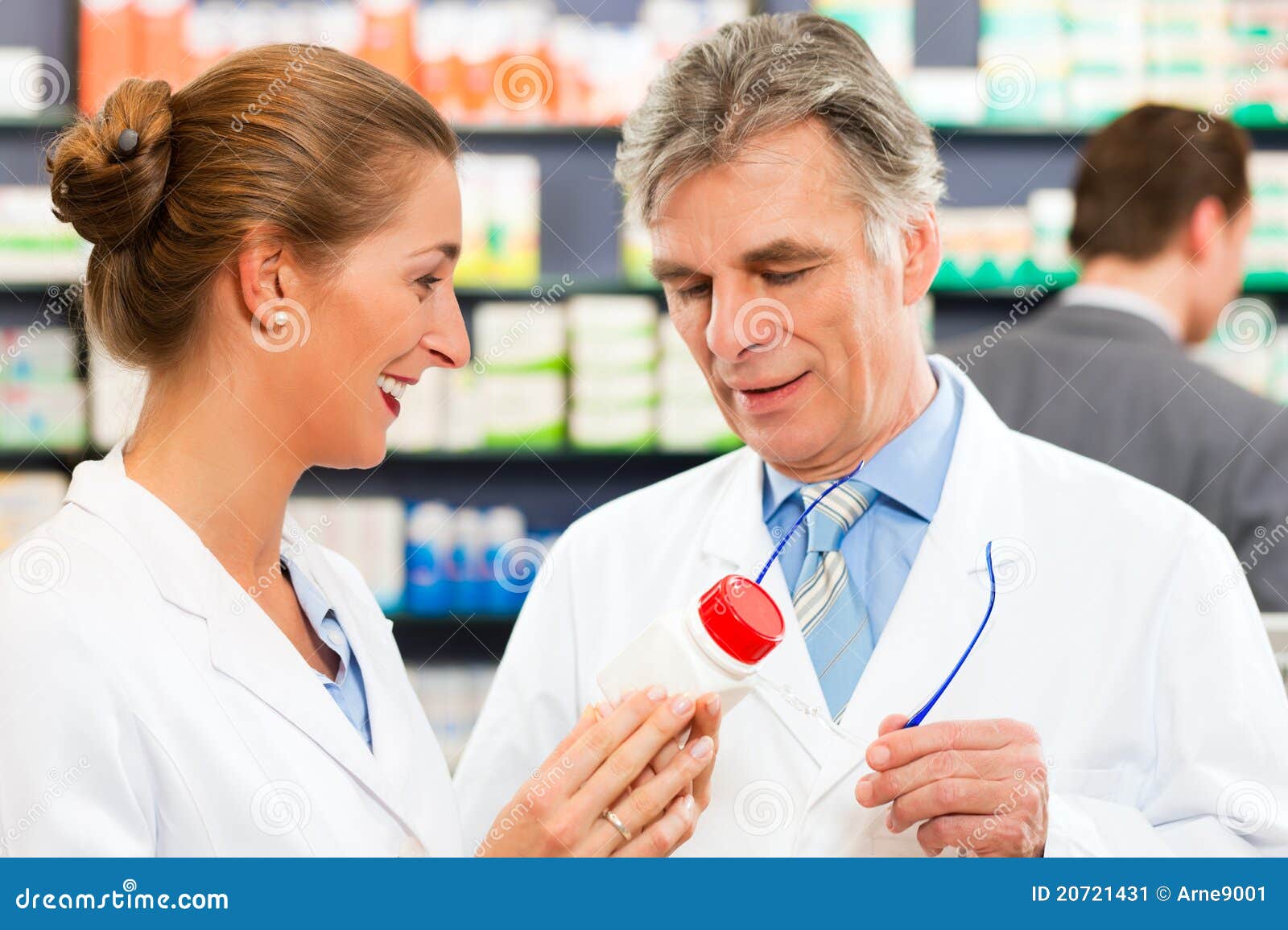 Two Pharmacists In Pharmacy Consulting Stock Image Image of