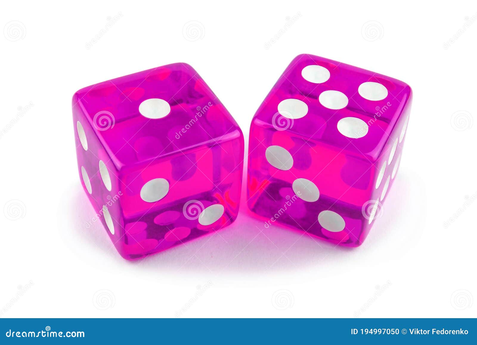 Two Pink Glass Dice, Macro Photography. Isolated on White with Light
