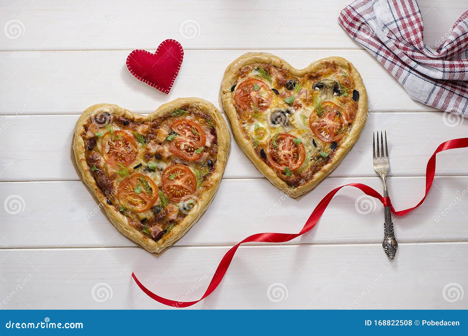 Two Pizza In The Form Of A Heart On A White Wooden Background With A ...