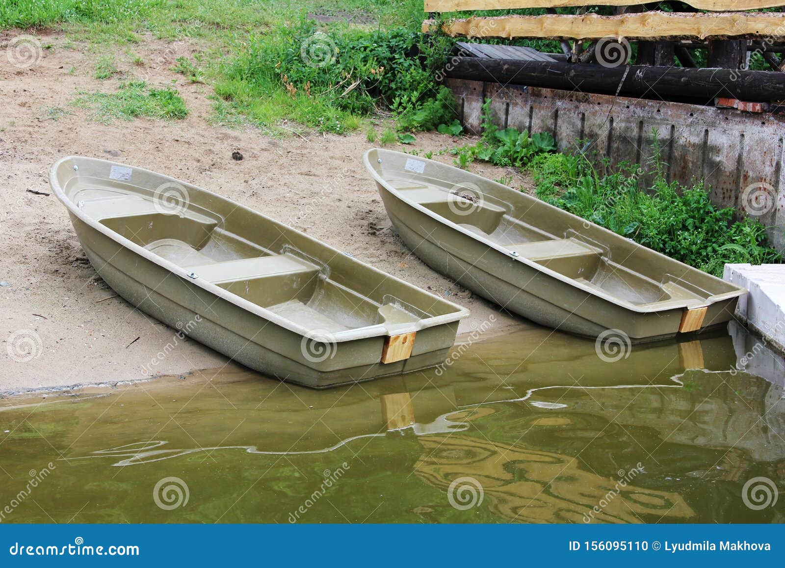 https://thumbs.dreamstime.com/z/two-plastic-boats-banks-river-istra-two-plastic-boats-banks-river-istra-summer-fishing-vacation-156095110.jpg