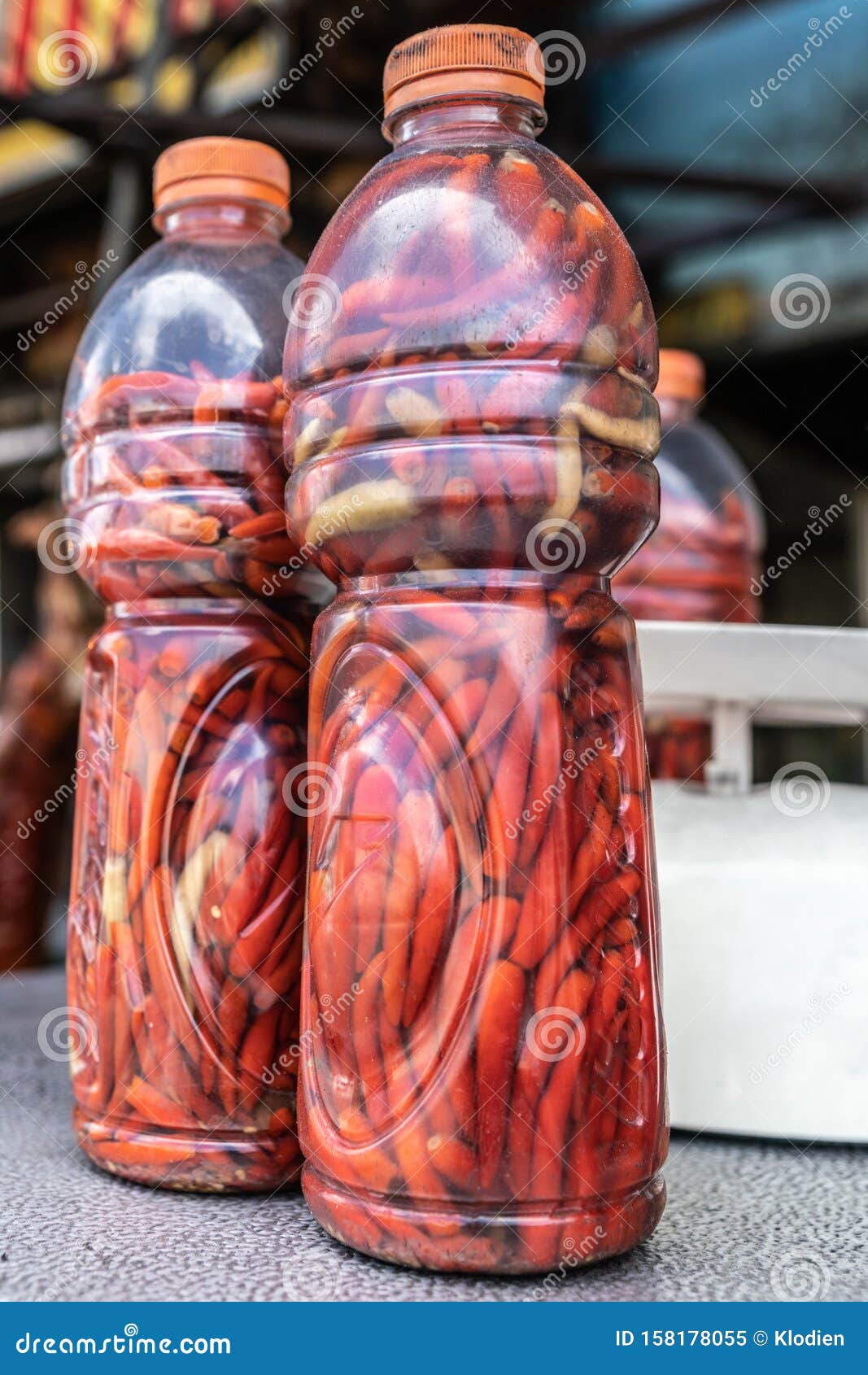 two plastic bottles filled with red carrots in manila, philippines