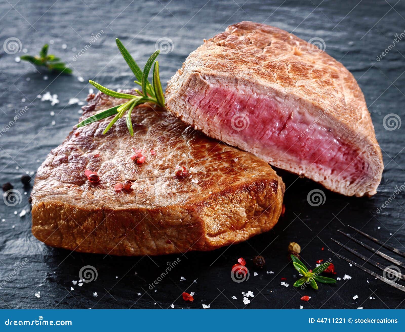 two portions of lean trimmed grilled beef steak