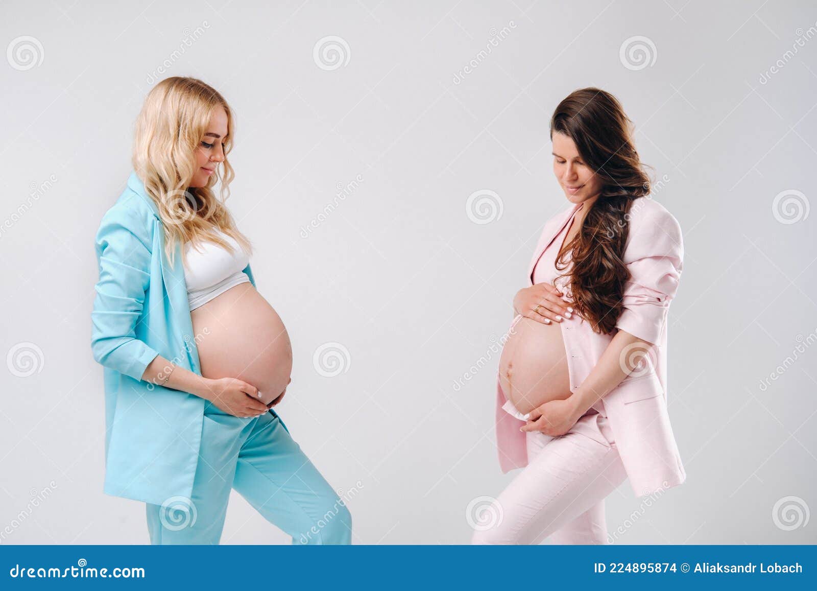 two pregnant women big bellies suits gray background two pregnant women big bellies suits gray 224895874