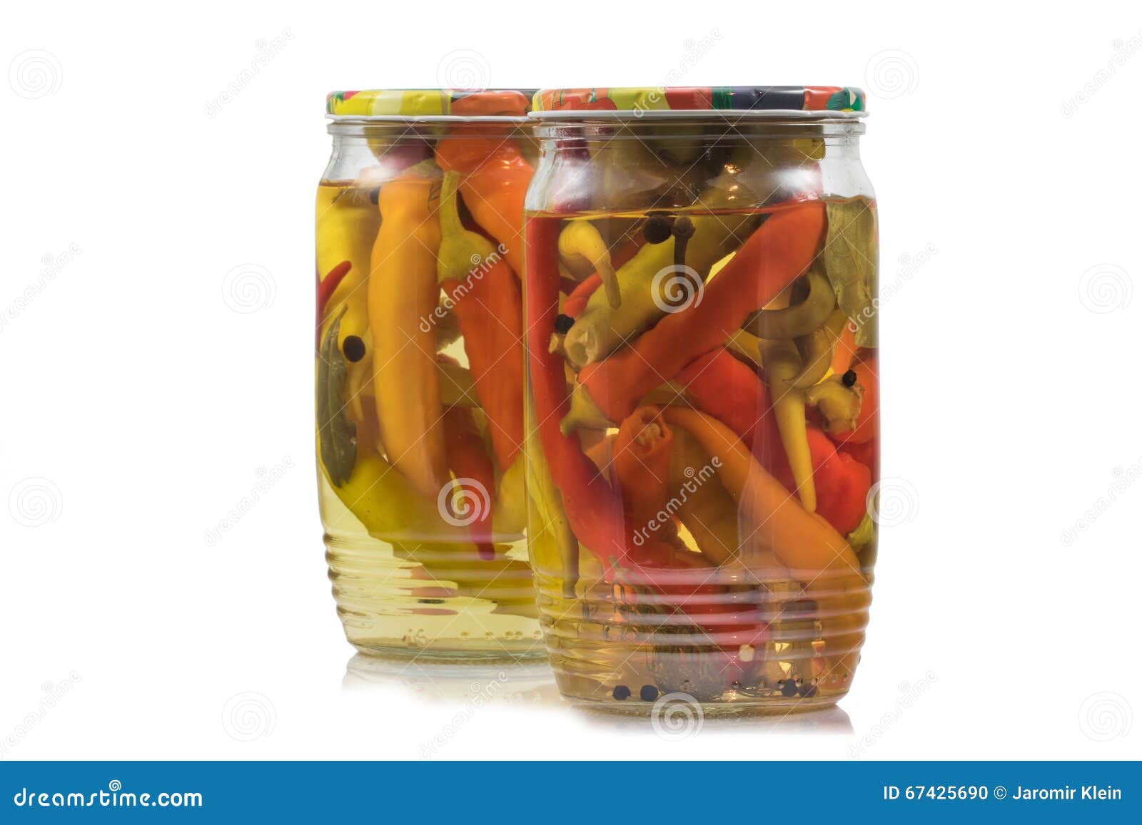 Two Preserved Pickled Chilli Peppers in Glass Jars on White Back Stock