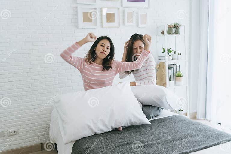 Two Pretty Best Friends Forever Girlfriend Talk Hug And Laugh Together On Bed At Cozy Home