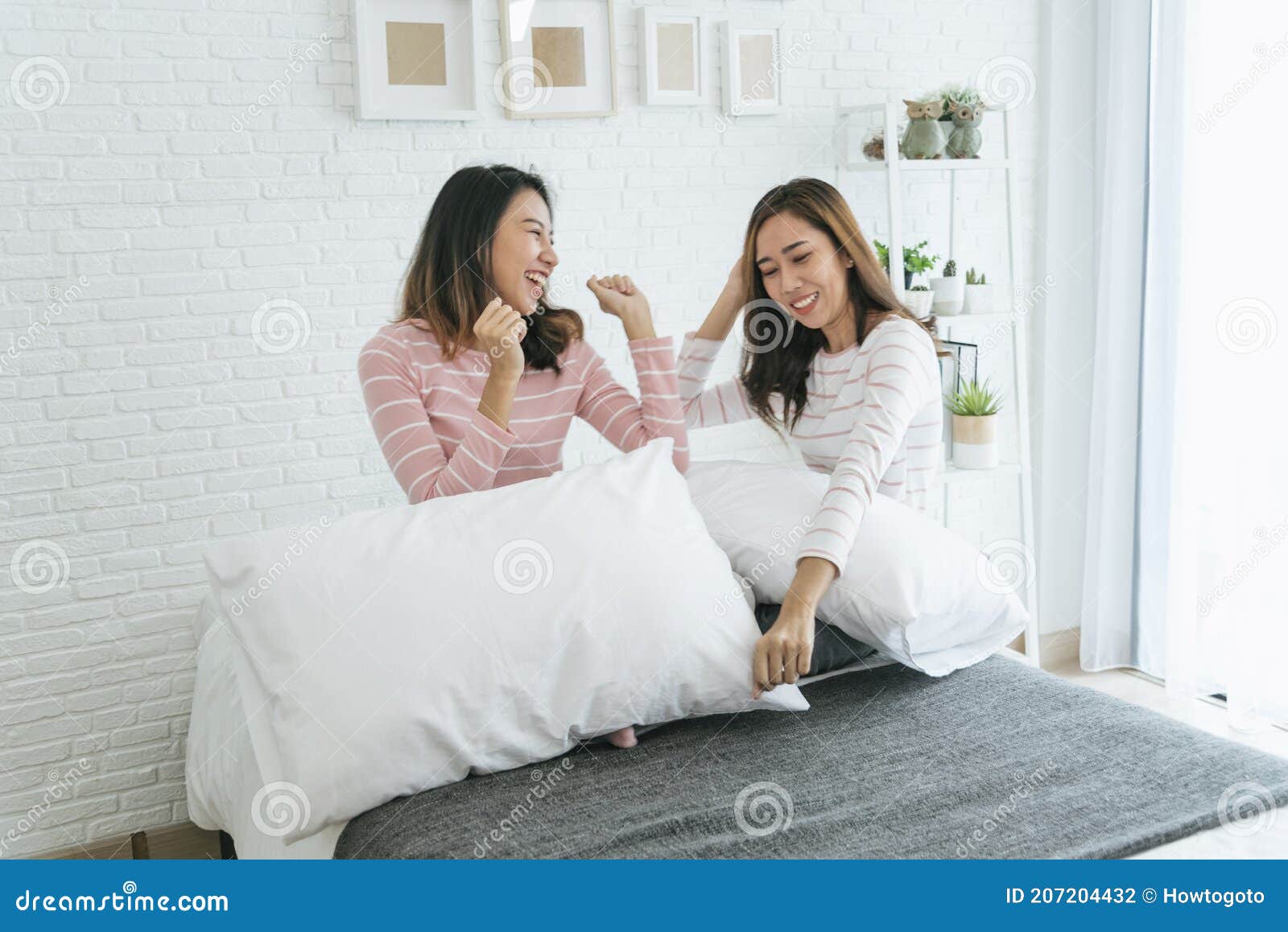 Two Pretty Best Friends Forever Girlfriend Talk Hug And Laugh Together On Bed At Cozy Home