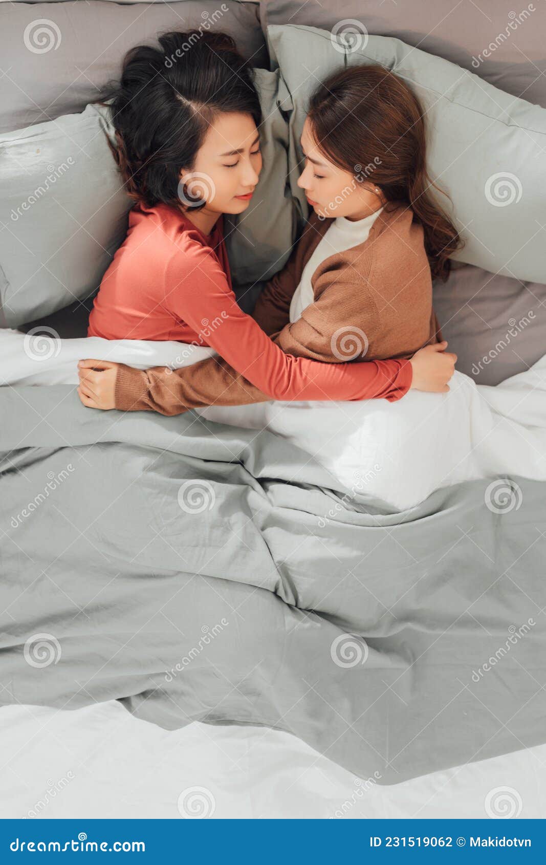 Two Pretty Best Friends Forever Girlfriend Talk Hug And Laugh Together On Bed At Cozy Home