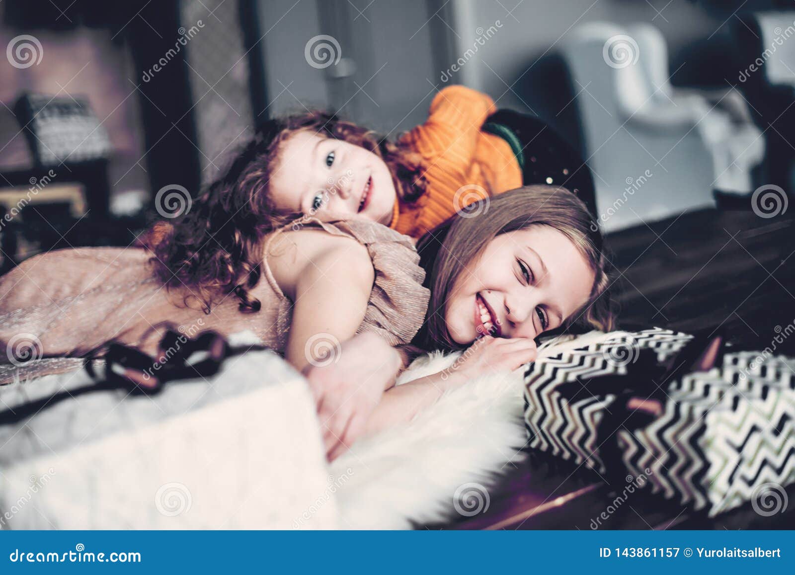 Two Pretty Sisters Are Having Fun In A Cozy Living Room Stock Image Image Of Background