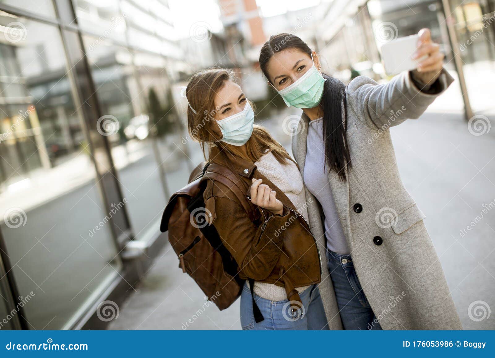 Pretty Young Women with Protective Facial Mask on the Street Stock ...