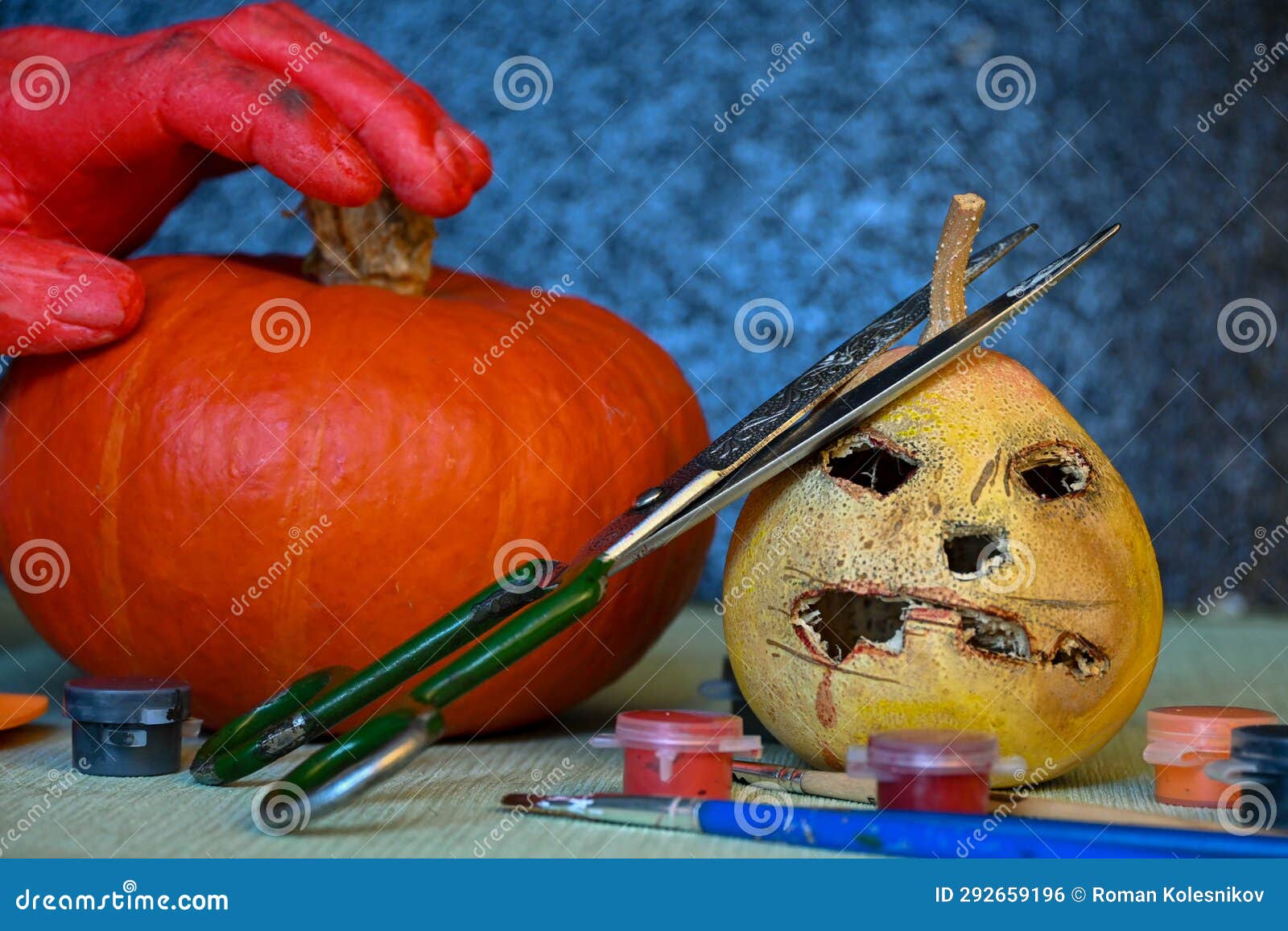 two pumpking preparing to become a halloween decortion.