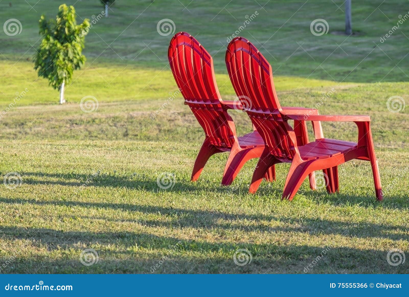 Two Red Adirondack Chairs stock photo. Image of relaxation 75555366