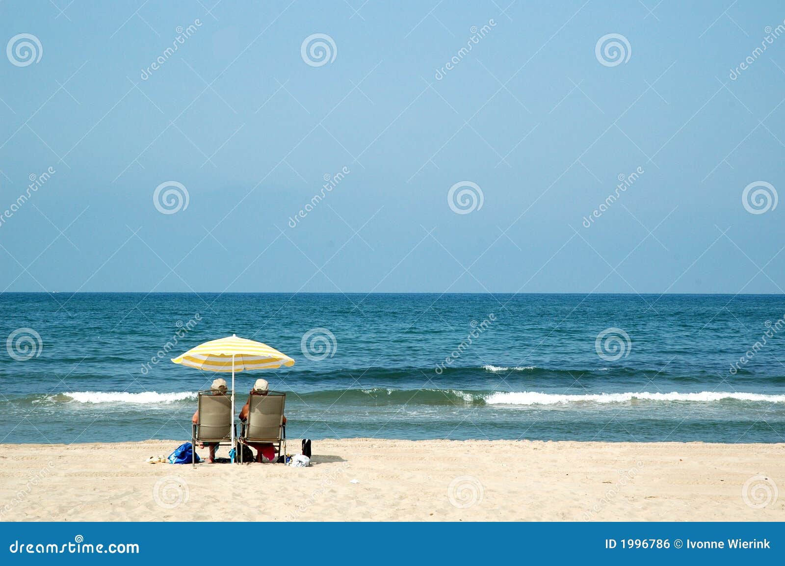 two retired people at the beach