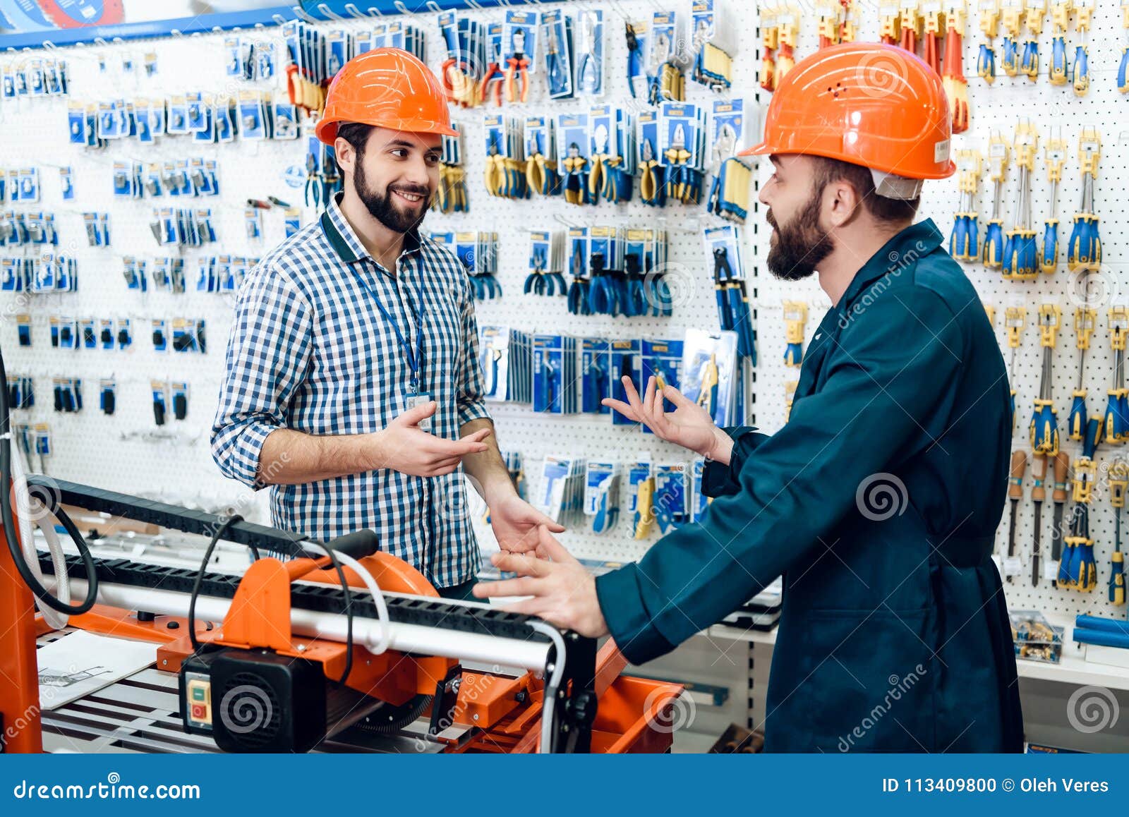 Two Salesmen Are Discussing Equipment Selection Near ... Two Salesmen Are Dis