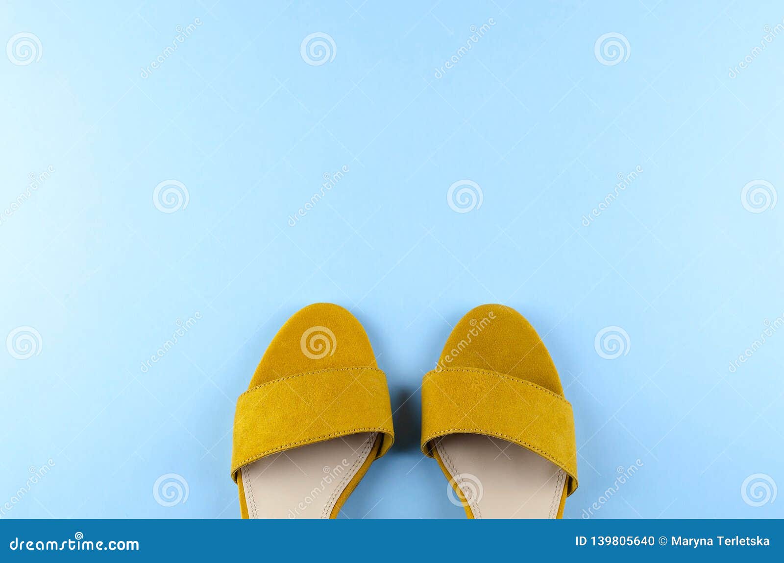 Two Sandals Mustard Color Blue Background Stock Photo - Image of copy ...