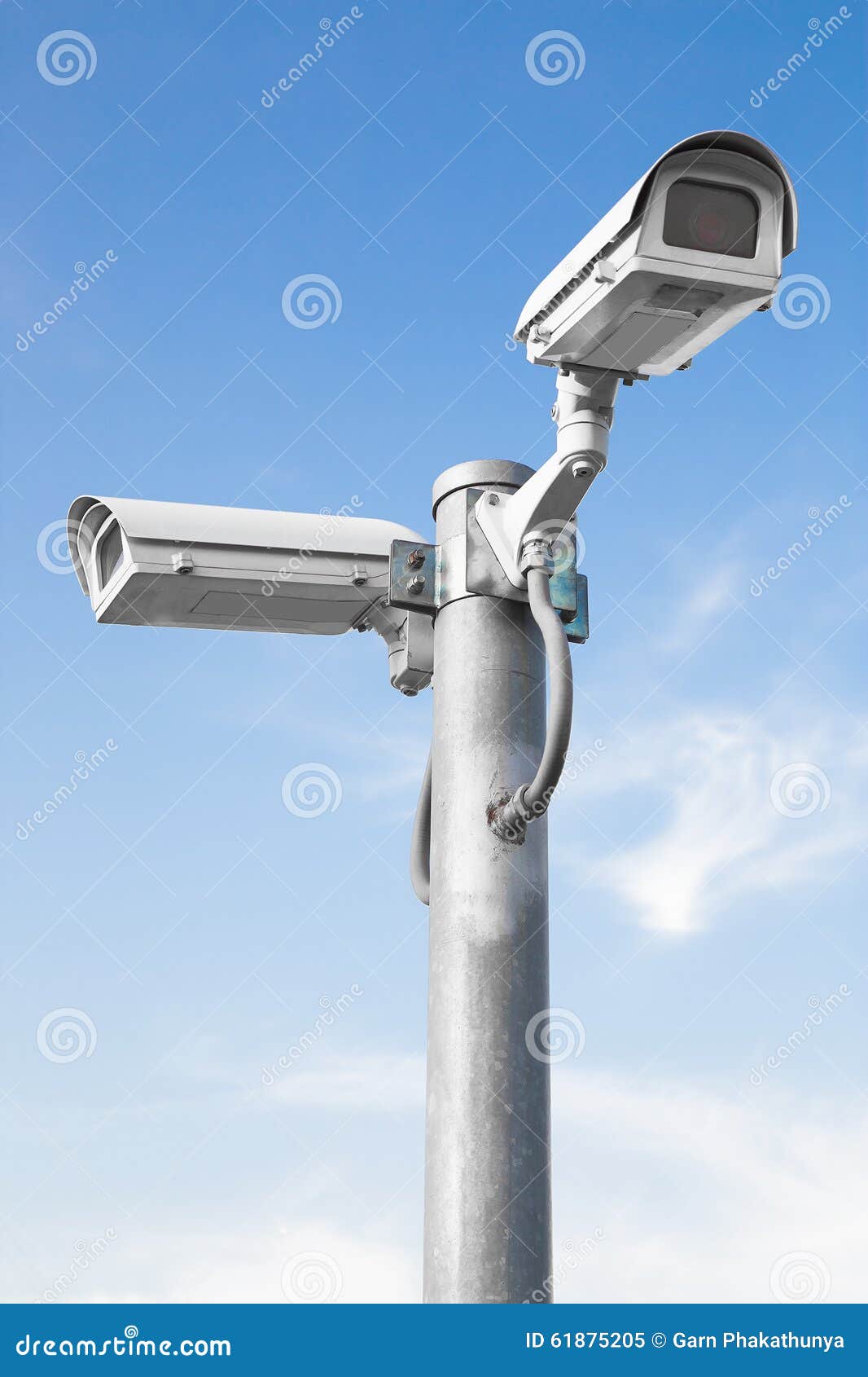 Two Security Cameras Against Blue Sky Selective Focus Stock Image