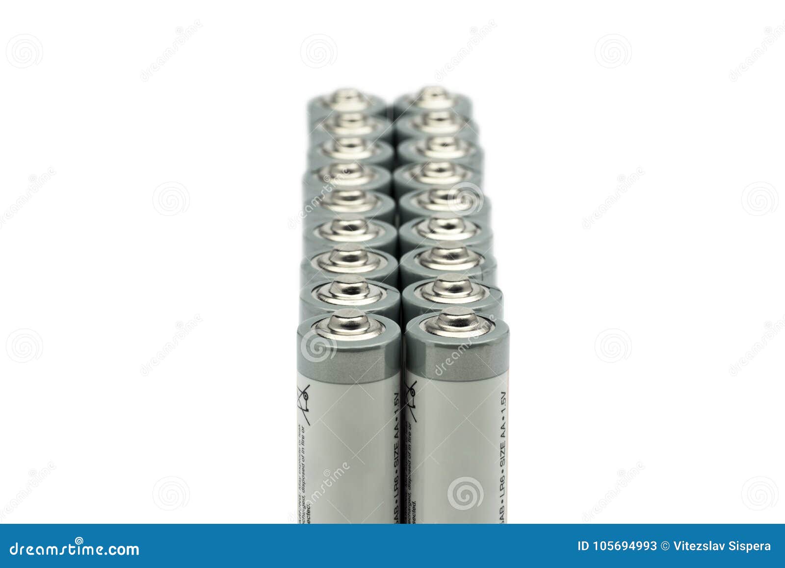 Two Series of Standing AA Batteries, Isolated on White Background Stock