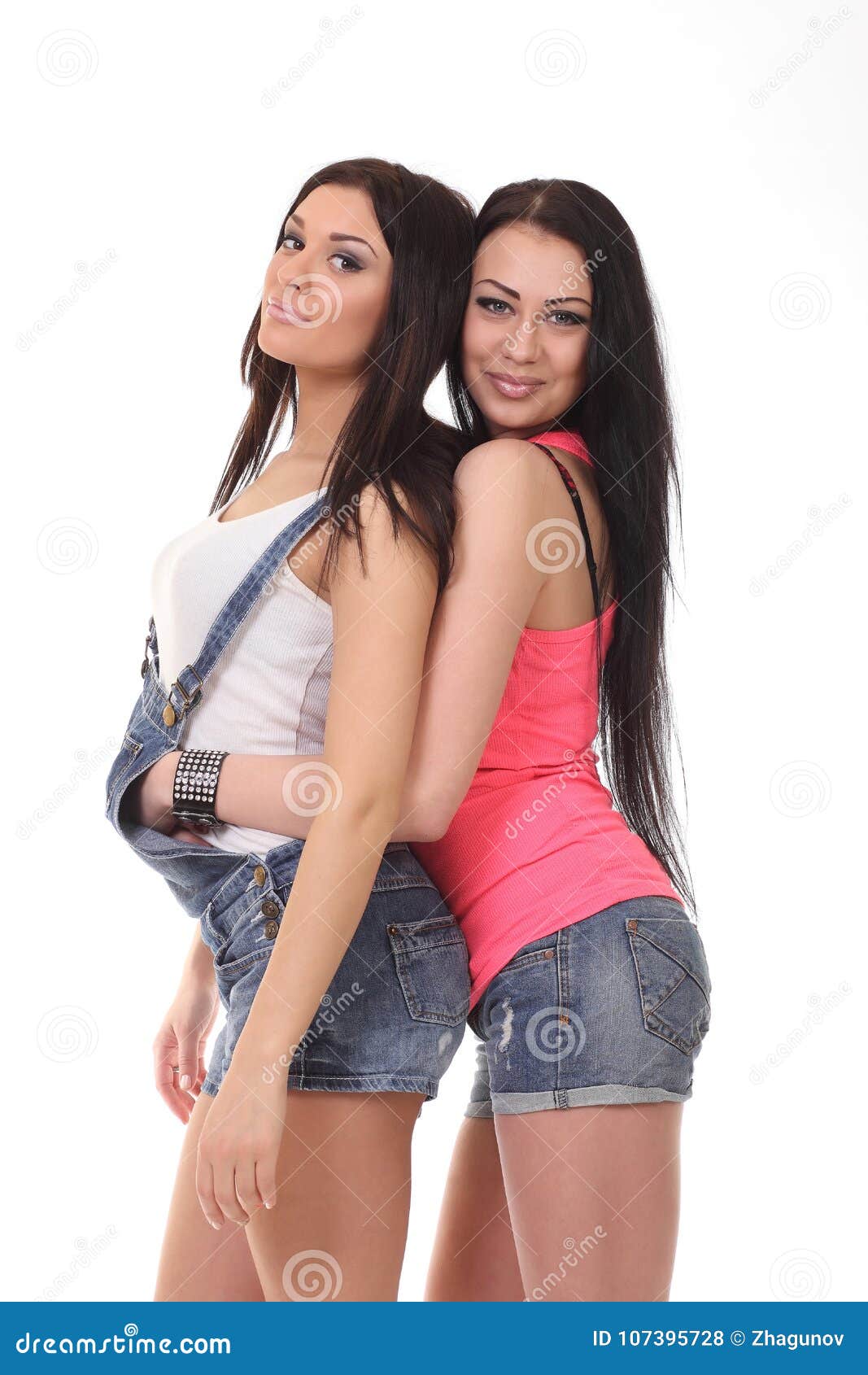 Two Young Girls On Sofa Relaxing High-Res Stock Photo 